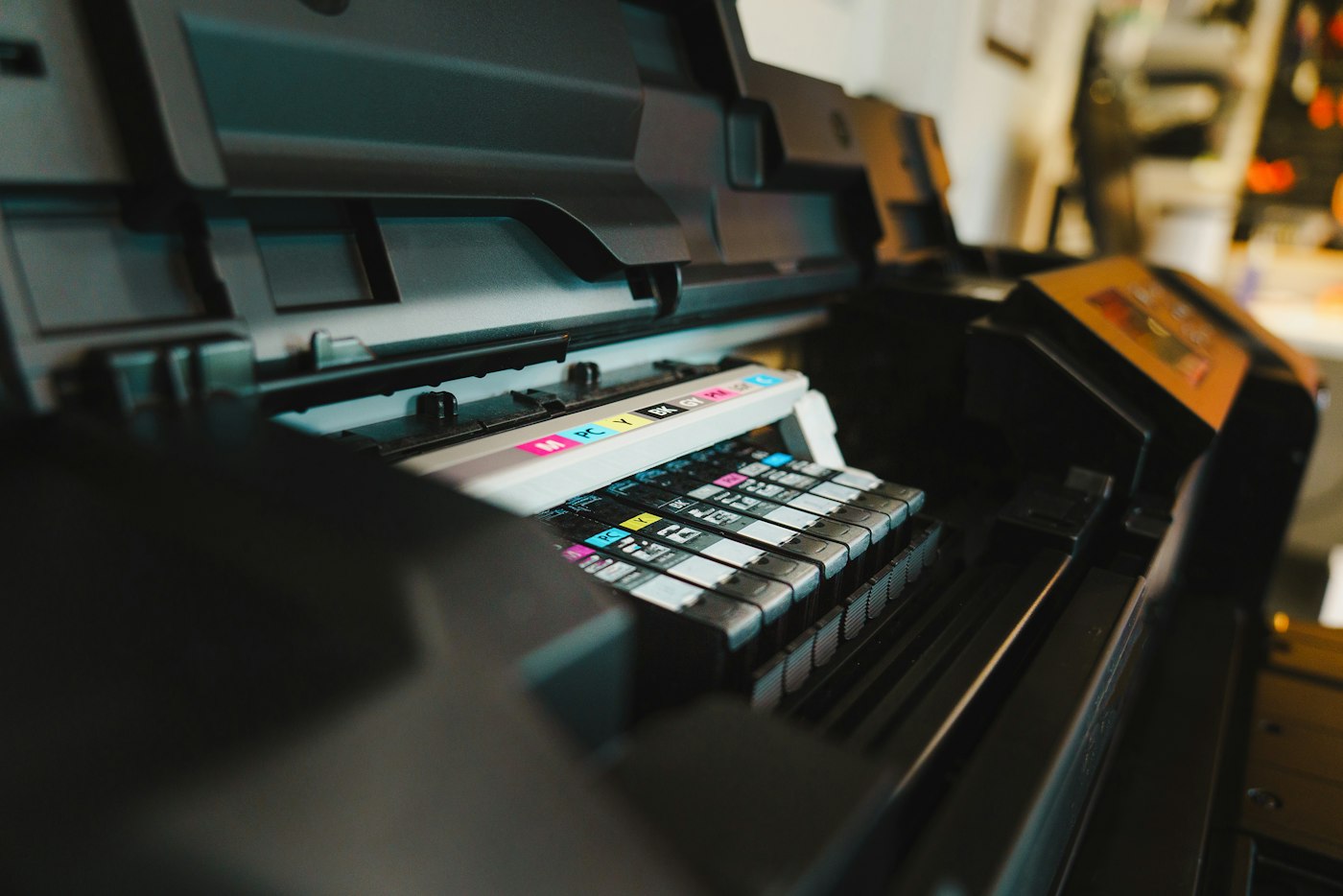 The ink heads of a printer, loaded with colour